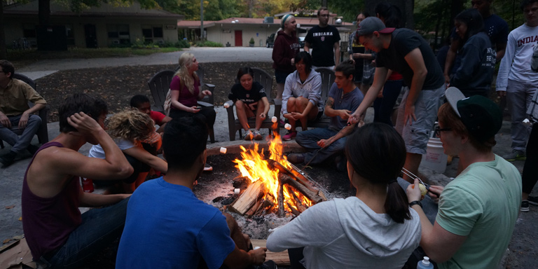 Group of students around a campfire